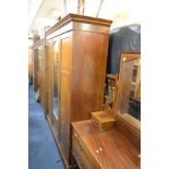 AN EDWARDIAN MAHOGANY AND INLAID TWO PIECE BEDROOM SUITE, comprising a triple door wardrobe with a