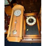 A MODERN BEECH CASED WALL CLOCK, marked Woodford, together with another wall clock, brass magazine