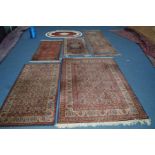 A 20TH CENTURY BOKARA STYLE RUSSET GROUND CARPET RUNNER, 226cm x 69cm, together with two similar