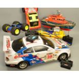 A QUANTITY OF RADIO CONTROLLED TOYS, to include a large scale B.M.W. Rally Car, R.N.L.I Lifeboat,