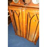 A WALNUT TWO DOOR DISPLAY CABINET (key)