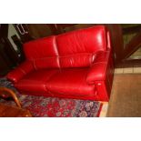 A MODERN RED LEATHER SOFA, with stitched detail, on light wood feet, length 198cm x depth 93cm x