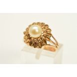 A CULTURED PEARL RING, designed as a central cultured pearl within a two tiered petal style