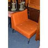 A RUSSET BROWN VINYL CHAIR