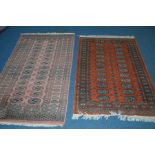 A WOOLLEN TEKKE RUSSET GROUND RUG, 153cm x 94cm, together with two other tekke ground rugs, 178cm