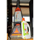 A VAX CARPET CLEANER together with a bottle of Vax carpet shampoo (2)