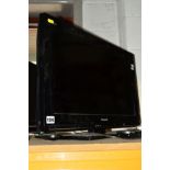 A PANASONIC 24'' FSTV (remote)