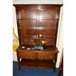 A REPRODUCTION OAK DRESSER, the top with a triple plate rack above two drawers and an undershelf,