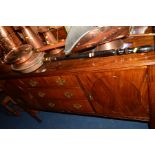 AN EDWARDIAN MAHOGANY SIDEBOARD, flanked by cupboard doors and three drawers centrally, width