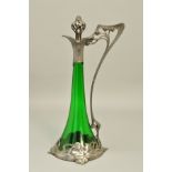 AN ART NOUVEAU WMF (ATTRIBUTED) CLARET JUG, the conical green glass body with openwork stopper and