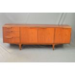 A MCINTOSH AND CO TEAK SIDEBOARD, with double cupboard doors revealing a shaped shelf, flanked by