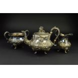 A VICTORIAN SILVER PLATED THREE PIECE TEA SERVICE, of baluster form, embossed foliate decoration,