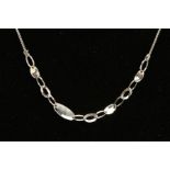 A MODERN 18CT WHITE GOLD FANCY NECKLET, central section comprised of alternating solid ovals and