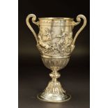 A VICTORIAN SILVER TWIN HANDLED TROPHY CUP, decorated with an engraved band of rolling waves above a