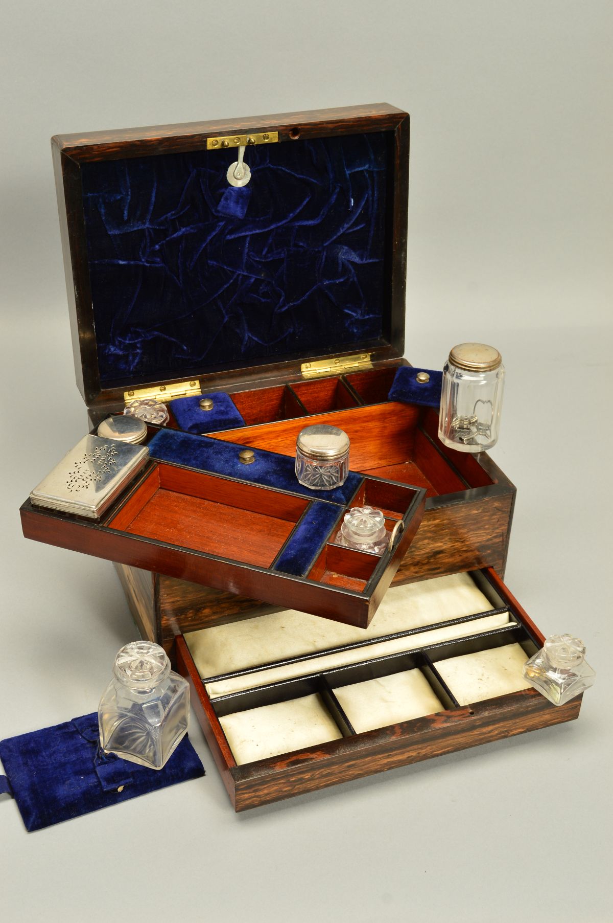 A VICTORIAN COROMANDEL DRESSING CASE, rectangular mother of pearl cartouche to hinged cover and