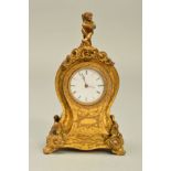 A LATE 19TH CENTURY MINIATURE GILT METAL CLOCK, with cherub finial above balloon shaped case,