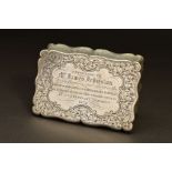 A VICTORIAN SILVER SNUFF BOX, of shaped rectangular form, foliate engraved decoration throughout