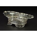 AN EARLY 20TH CENTURY DUTCH SILVER OVAL DISH, the wavy rim with masks, foliate and geometric pierced
