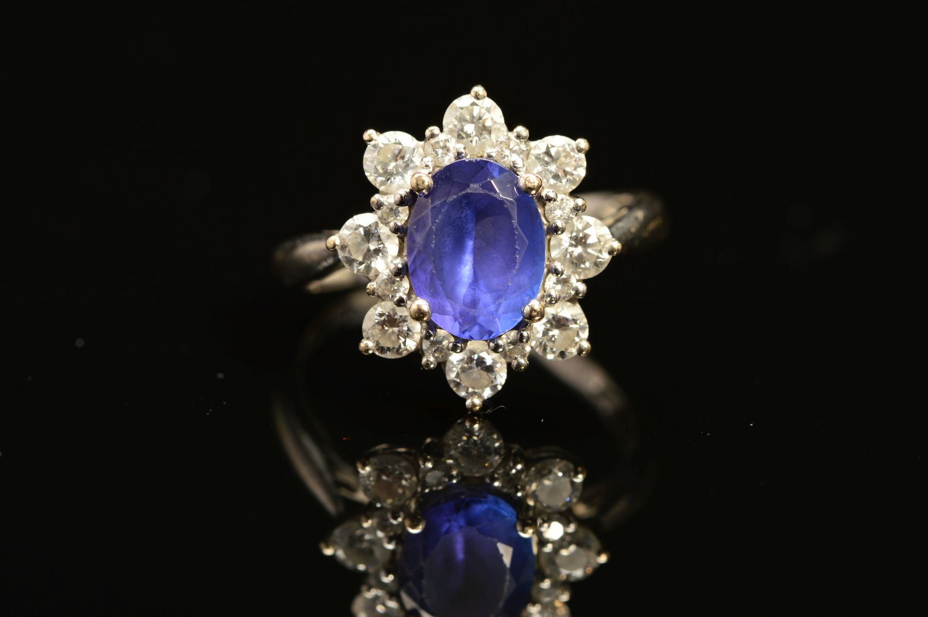 A MODERN 18CT WHITE GOLD TANZANITE AND DIAMOND OVAL CLUSTER RING, oval mixed cut tanzanite measuring - Image 2 of 5