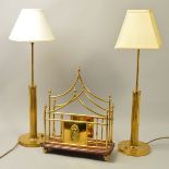 A PAIR OF EDWARDIAN STYLE BRASS COLUMN TABLE LAMPS, on a circular base with switches, remnants of