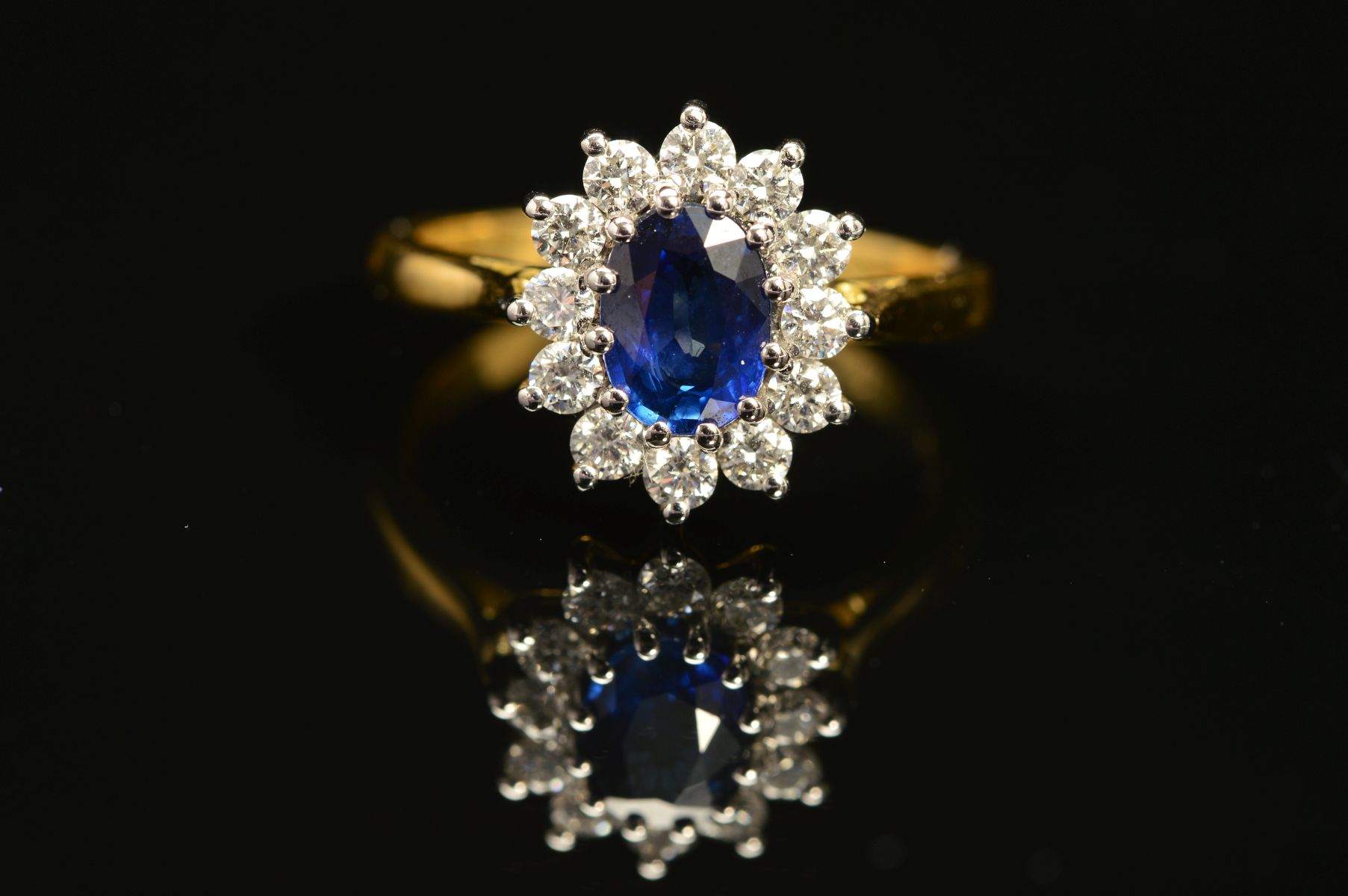 A MODERN 18CT GOLD SAPPHIRE AND DIAMOND OVAL CLUSTER RING, oval blue sapphire measuring - Image 2 of 5