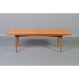 GORDON RUSSELL, BROADWAY WORKS, a teak coffee table, with shaped sides on four square tapering legs,