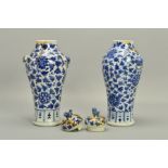 A PAIR OF CHINESE PORCELAIN BALUSTER VASES AND COVERS, decorated in underglaze blue with trailing