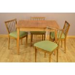 A GORDON RUSSELL OF BROADWAY WALNUT TOPPED EXTENDING DINING TABLE, with a single additional leaf