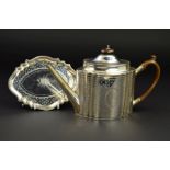 A GEORGE III SILVER TEAPOT AND STAND, of serpentine outline, dome oval hinged cover with fruitwood