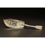 A VICTORIAN SILVER FIDDLE PATTERN FISH SLICE, engraved crest, foliate pierced blade, split across