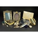 A PARCEL OF SILVER, the majority Edwardian and George V, includes a pair of oval silver backed