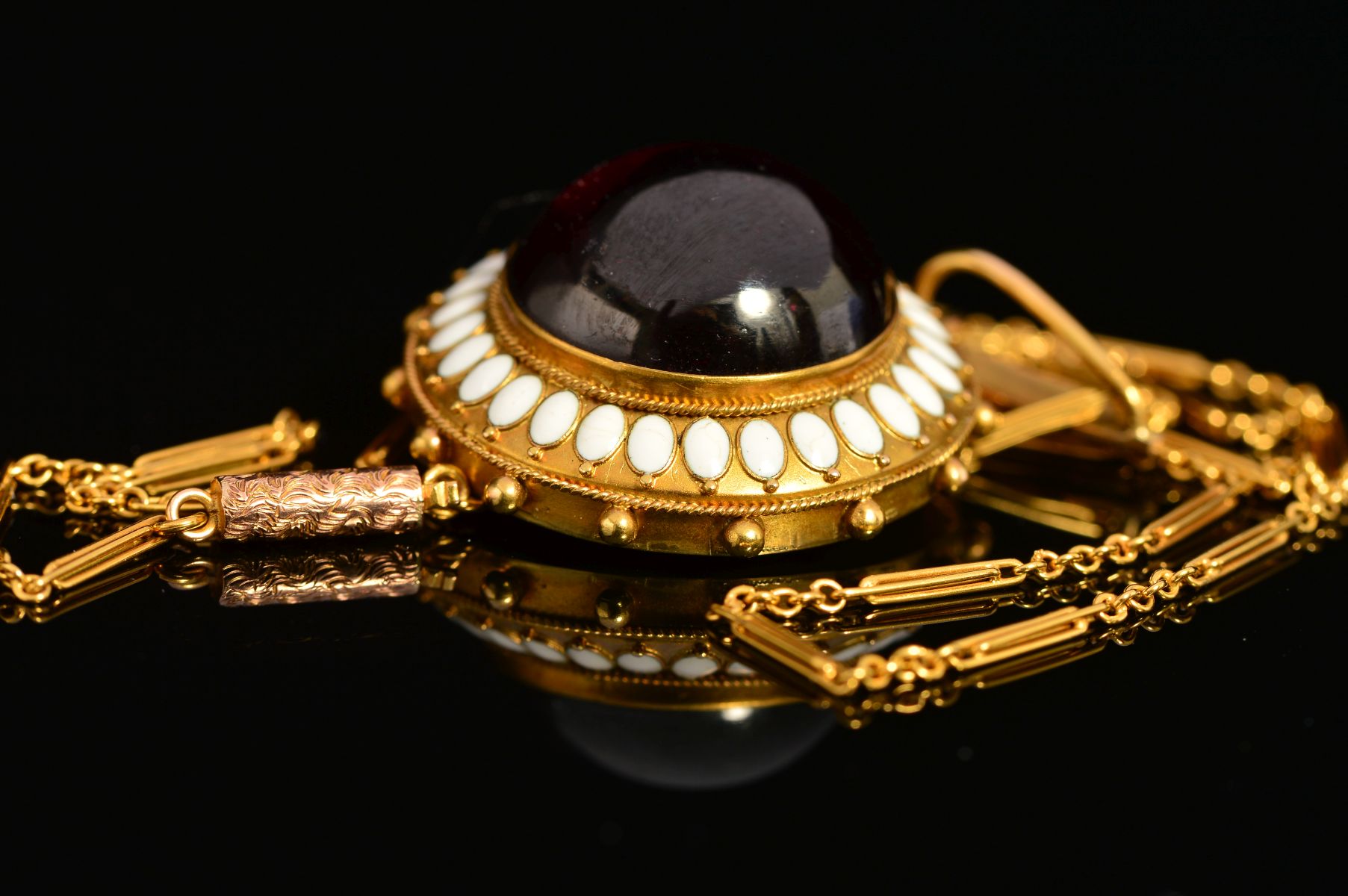 A MID VICTORIAN GOLD GARNET AND WHITE ENAMEL PENDANT, centring on a large cabochon circular garnet - Image 4 of 5