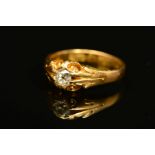 A MID VICTORIAN 18CT GOLD SINGLE STONE DIAMOND RING, set with an old cut diamond to the scrolling