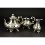 A VICTORIAN SILVER THREE PIECE TEASET, of baluster form, the teapot with flower head finial, ivory
