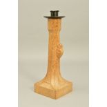 ROBERT (MOUSEMAN) THOMPSON, a carved oak candlestick with a wrought iron sconce, workshop