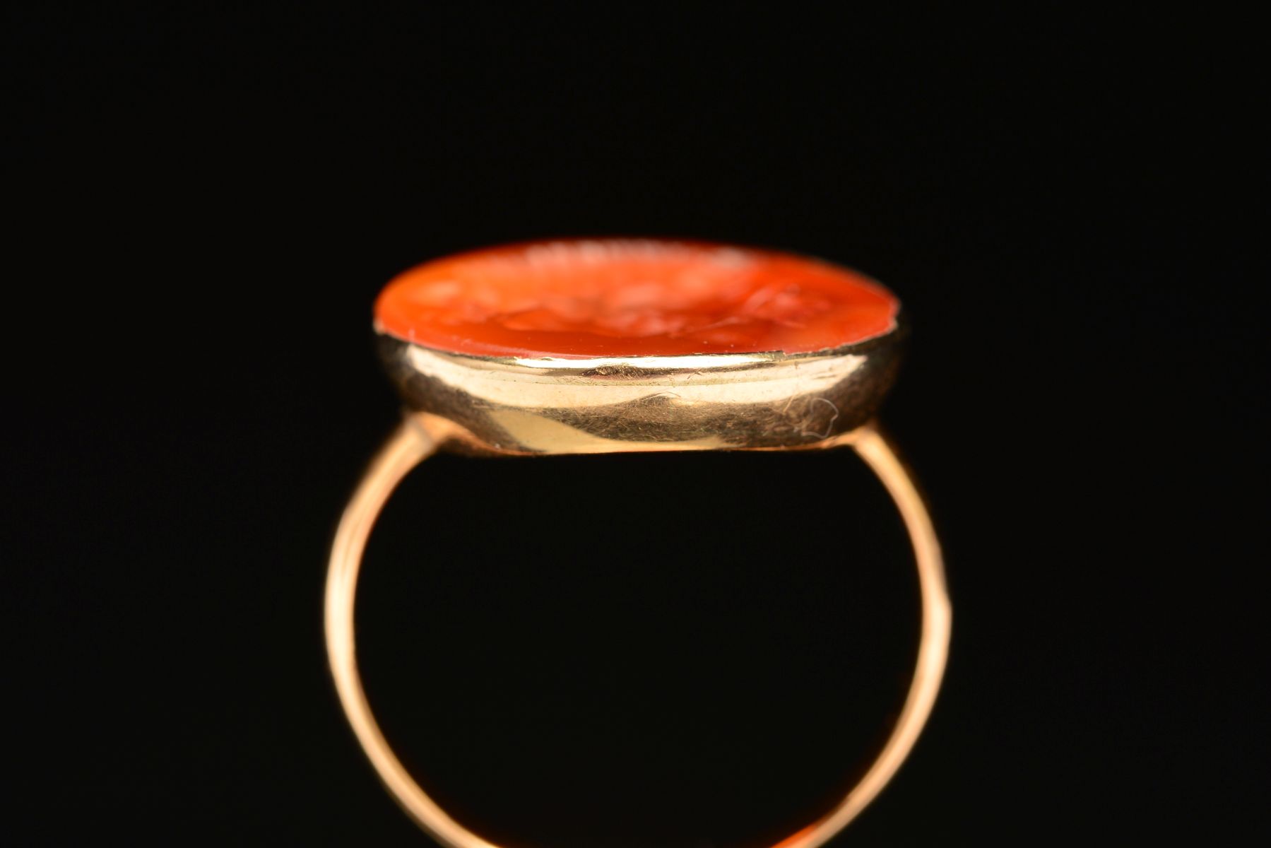 A CARNELIAN INTAGLIO RING, the oval carnelian carved to depict a bearded man, within a collet - Image 5 of 5