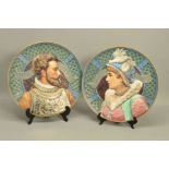 A PAIR OF RELIEF MOULDED CONTINENTAL PORCELAIN WALL PLAQUES, depicting portraits of Alexander