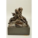 A VICTORIAN BRONZE OF TWO SEATED CHERUBS EMBRACING, with a shell shaped recess before them and a