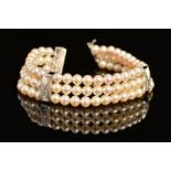 A MODERN 18CT WHITE GOLD, THREE ROW CULTURED PEARL AND DIAMOND BRACELET, each row intersected by a