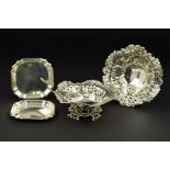 A PAIR OF LATE VICTORIAN SILVER BON BON DISHES, of wavy circular form, pierced and repousse