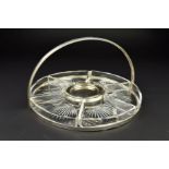 A GEORGE V SILVER CIRCULAR HORS D'OEUVRES TRAY, with fixed carry handle above the open frame, fitted