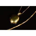 A MODERN 18CT GOLD OVAL LOCKET, plain polished finish, measuring approximately 25mm x 19.0mm,