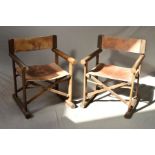 A PAIR OF 1980'S ROSEWOOD AND LEATHER FOLDING DIRECTOR'S CHAIRS, cylindrical armrests and feet,