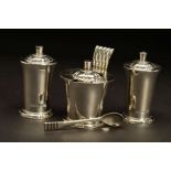 AN ELIZABETH II SILVER FOUR PIECE CRUET SET BY ROBERT EDGAR STONE, of conical form, with domed