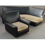 A 1960’S/70’S BLACK VINYL THREE SECTION DOG LEG CORNER SOFA AND MATCHING SINGLE ARMCHAIR, with