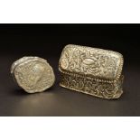 A LATE 19TH CENTURY CONTINENTAL SILVER BOX, of shaped oval form, the hinged cover embossed with a