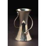AN EDWARDIAN SILVER TWIN HANDLED ARTS & CRAFTS STYLE VASE, of conical form, flared rim with two