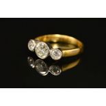 AN 18CT GOLD THREE STONE DIAMOND RING, designed as three brilliant cut diamonds within collet