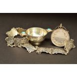 A GEORGE V SILVER MINIATURE QUAICH, the handles inset with a turquoise cabochon, engraved name below