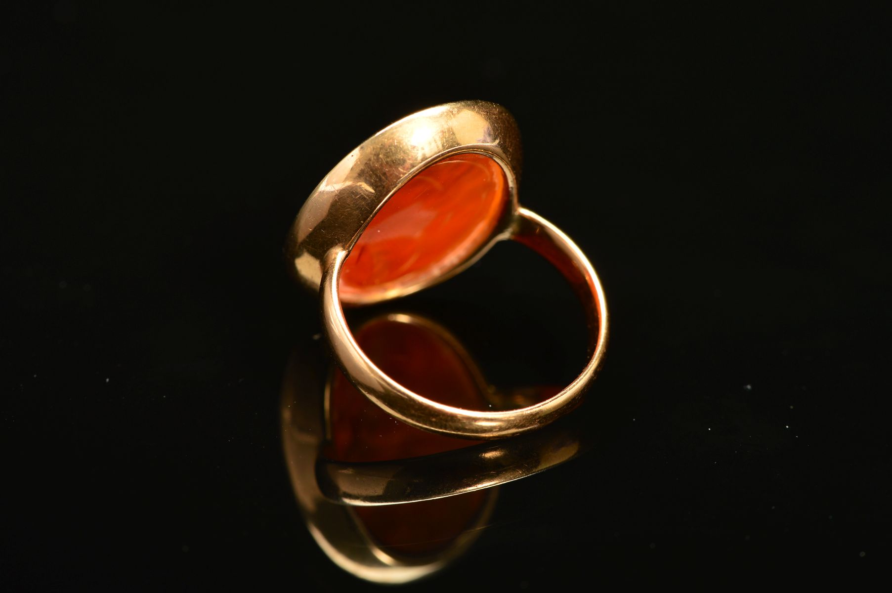 A CARNELIAN INTAGLIO RING, the oval carnelian carved to depict a bearded man, within a collet - Image 4 of 5